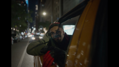 a man with his head out of a car window