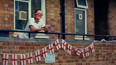 a woman wearing goggles sitting on a balcony