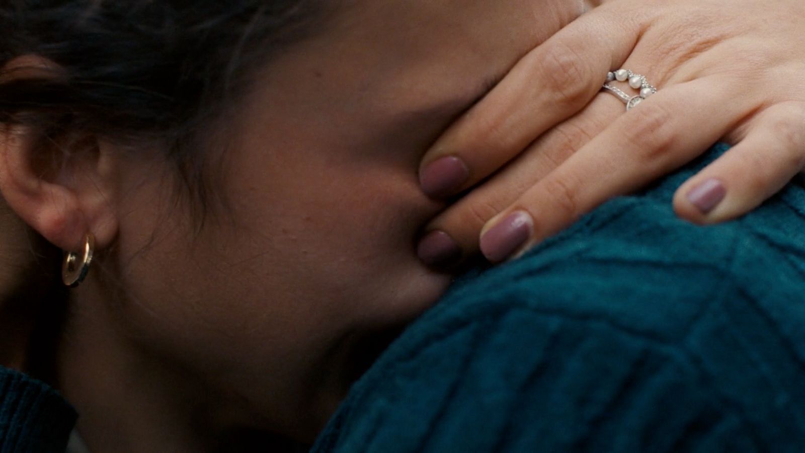 a close up of a person with a ring on their finger