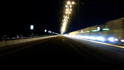 a blurry photo of a city street at night