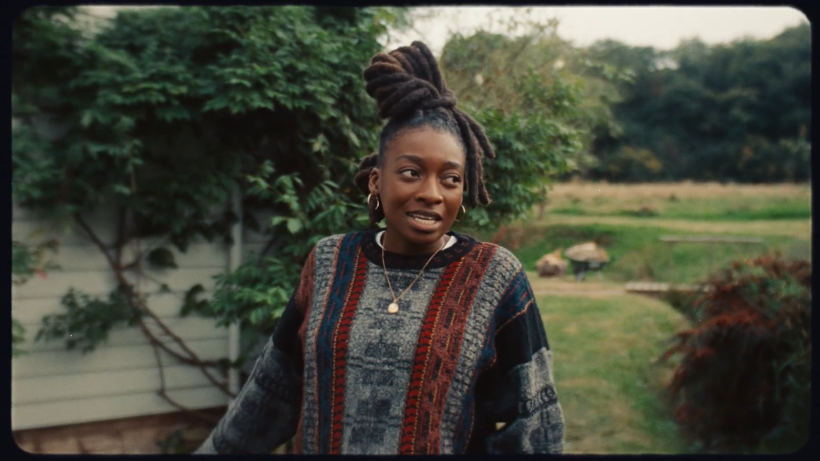 a woman standing in front of a house