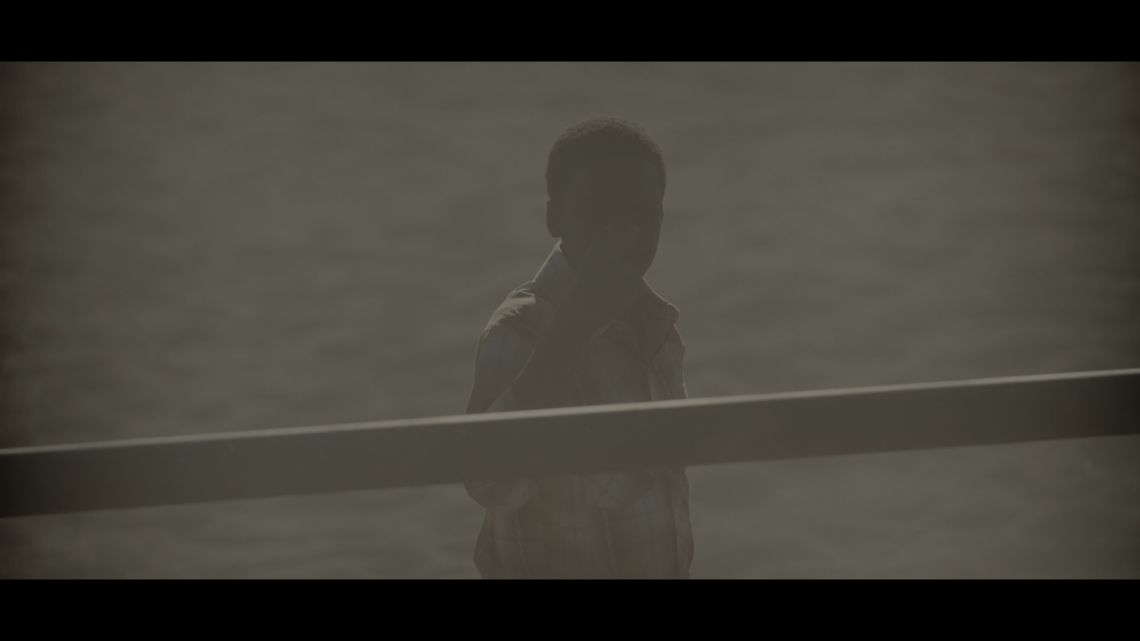 a person standing in front of a body of water