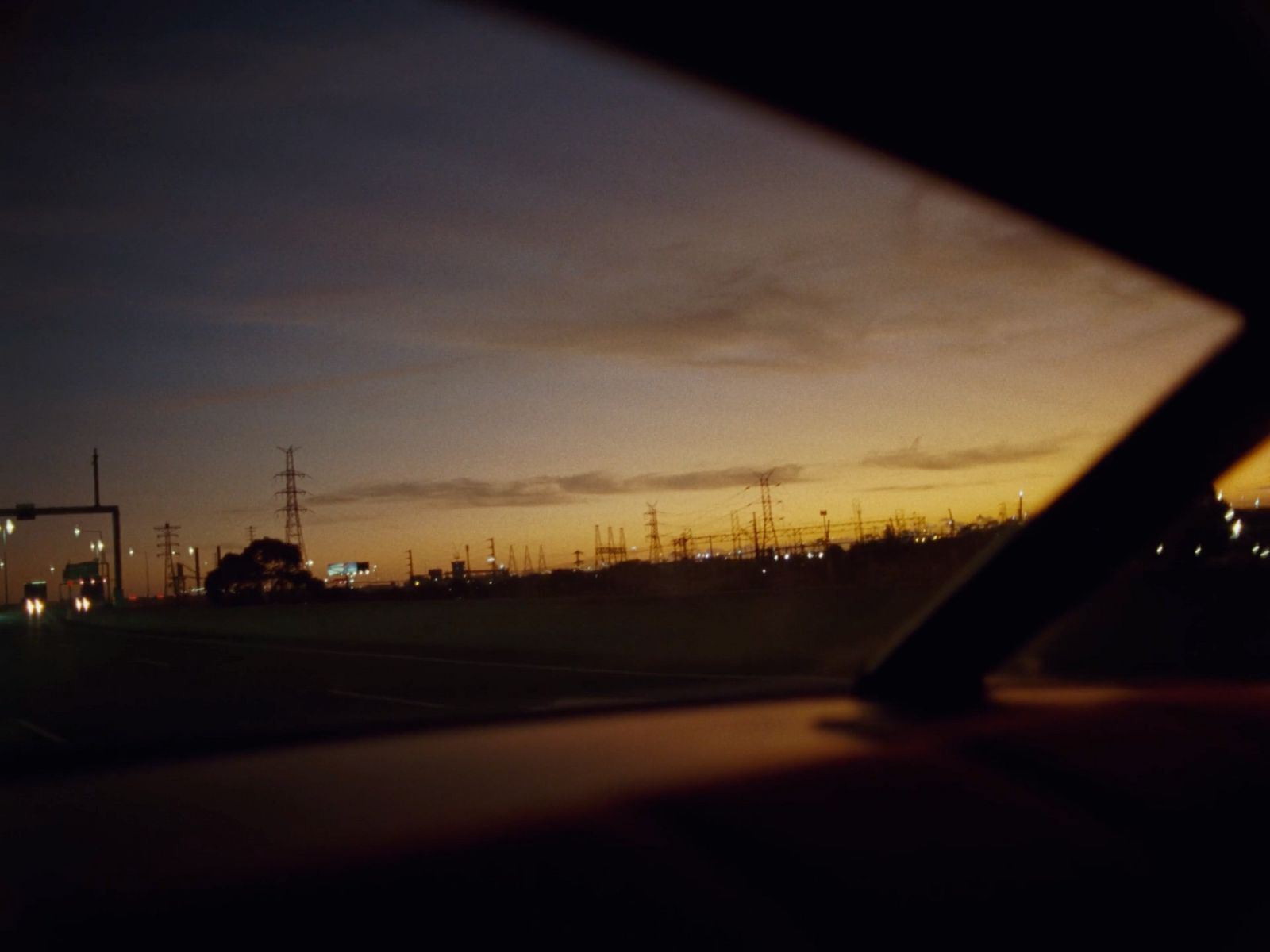 a view of a city at night from inside a car