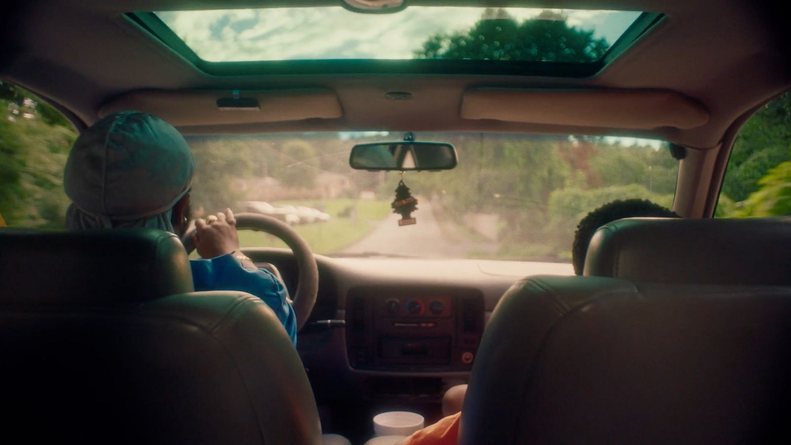 a couple of people that are sitting in a car