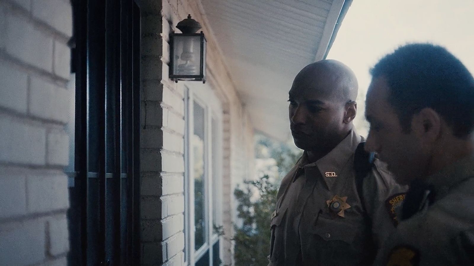 a couple of men standing next to each other