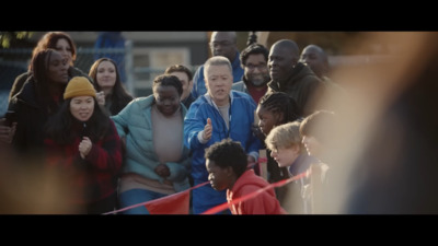 a group of people standing around each other