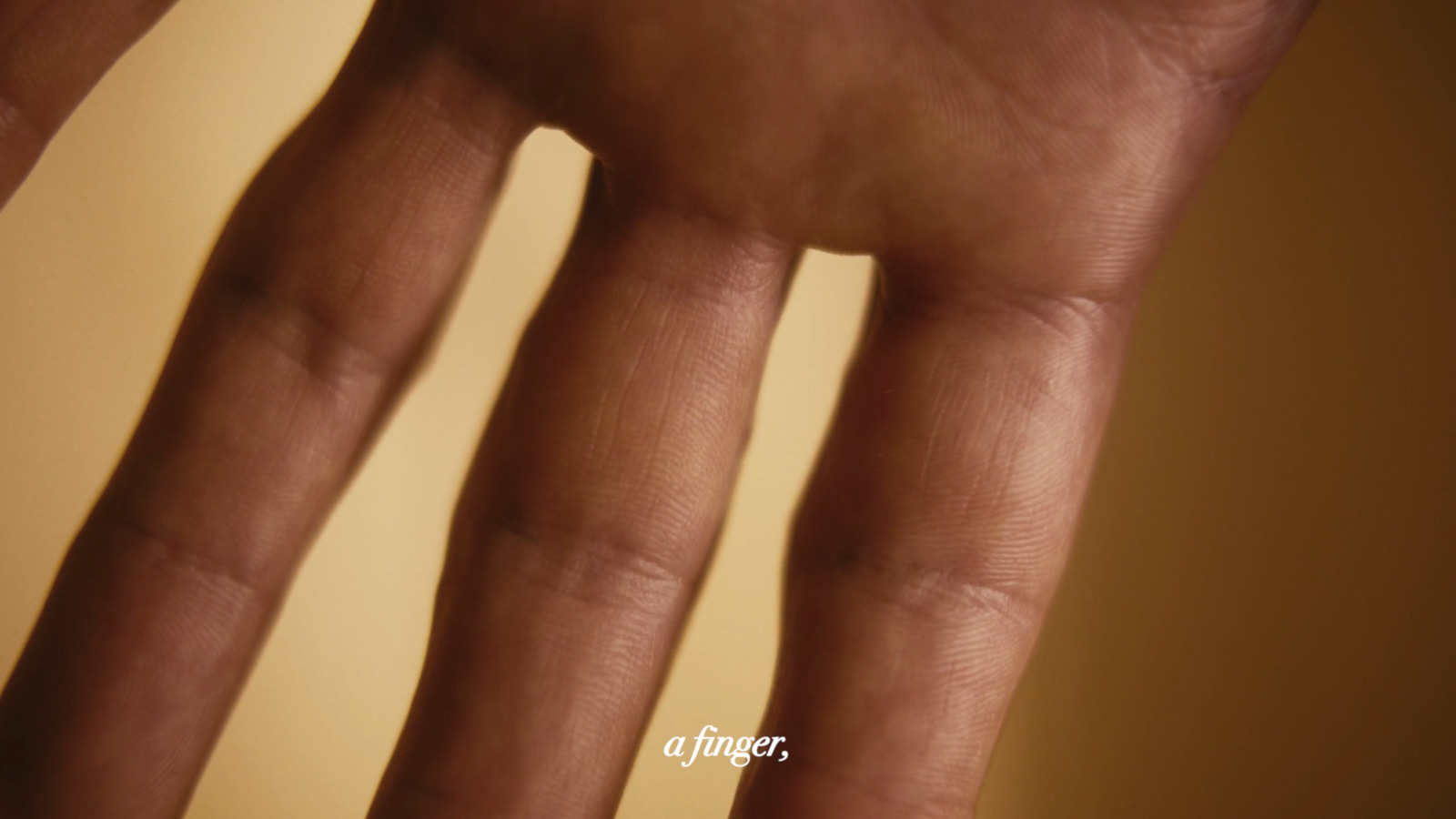 a close up of a person's hand holding a cell phone