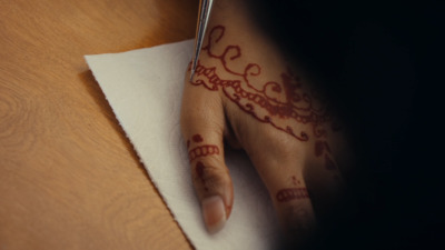 a woman's hand with a henna on it