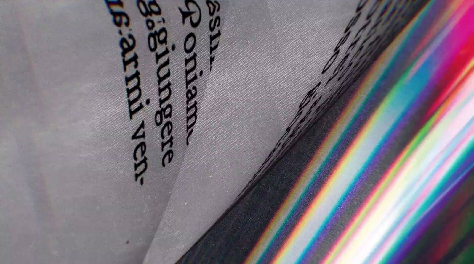 a close up of a bag with a rainbow pattern on it