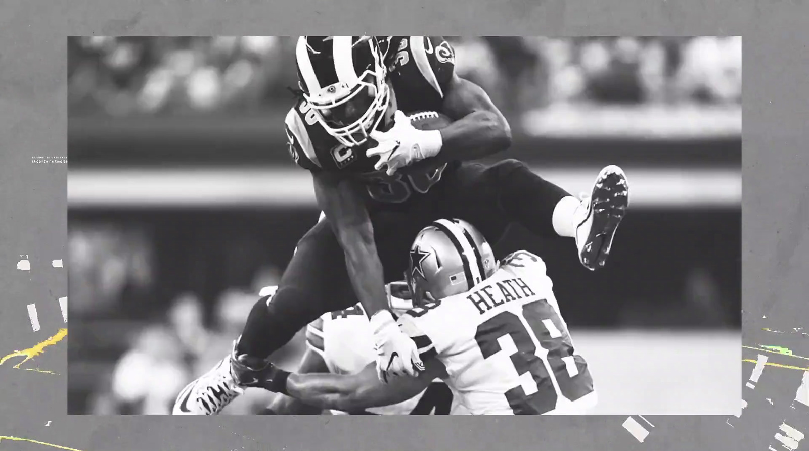 a black and white photo of two football players