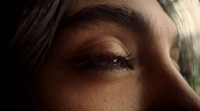 a close up of a woman's eye with long lashes