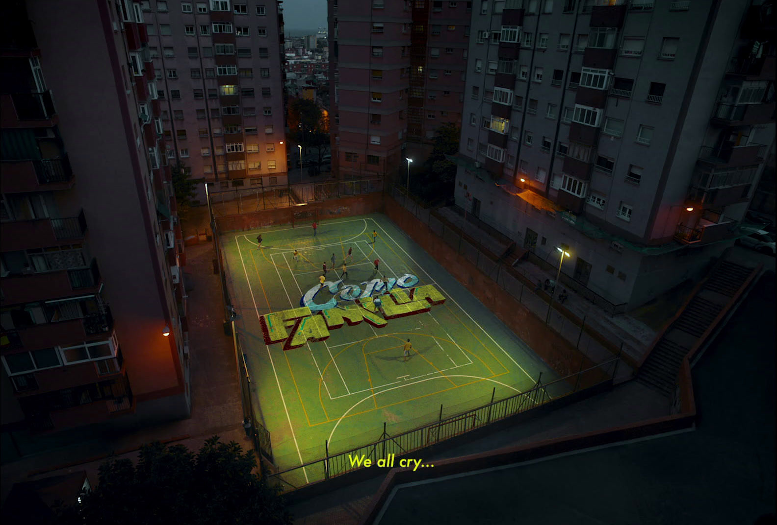 an aerial view of a soccer field in a city at night