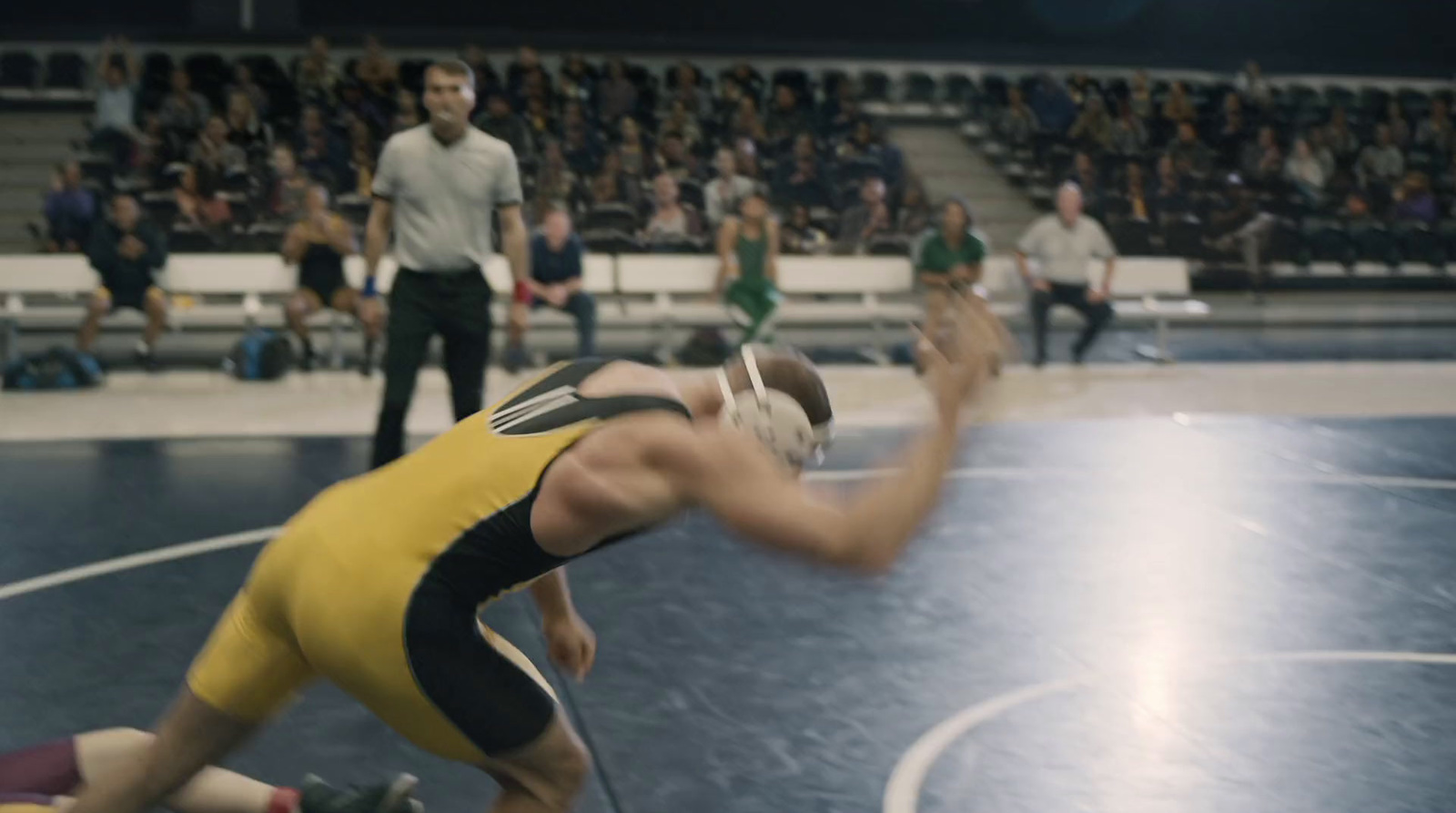 a wrestling match is being played in a stadium