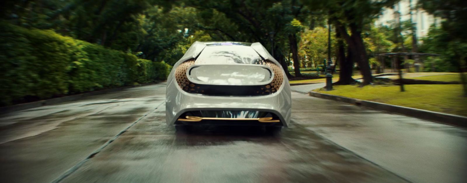 a white car driving down a wet road