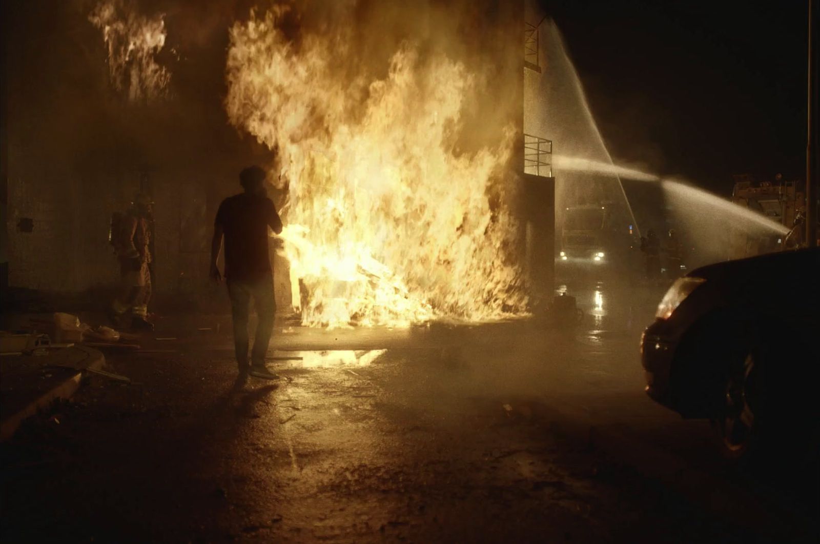 a man standing in front of a fire hydrant