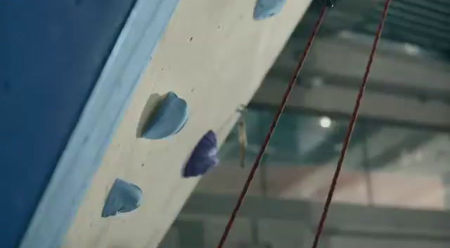 a close up of a rock climbing wall