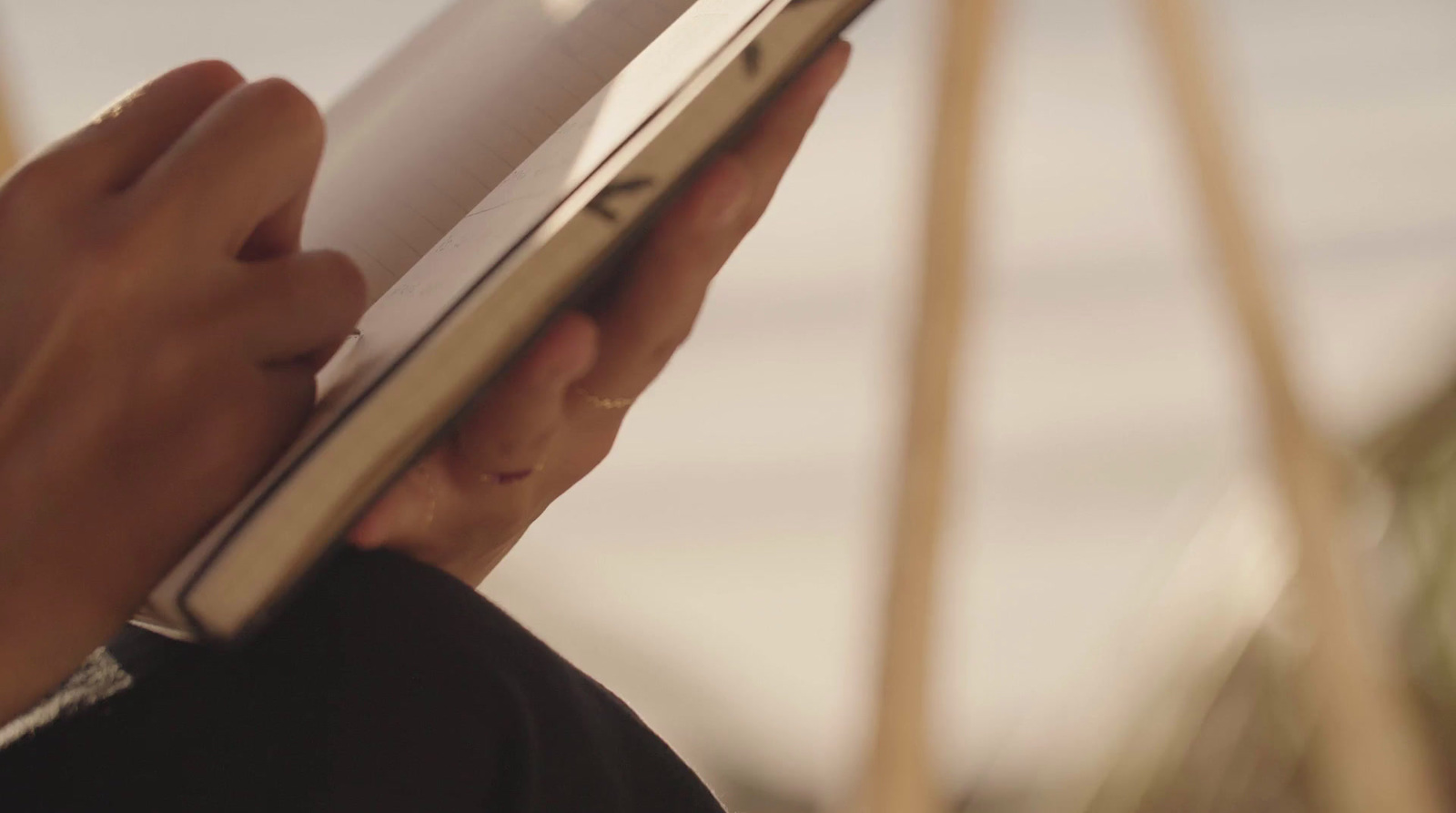 a close up of a person holding a book