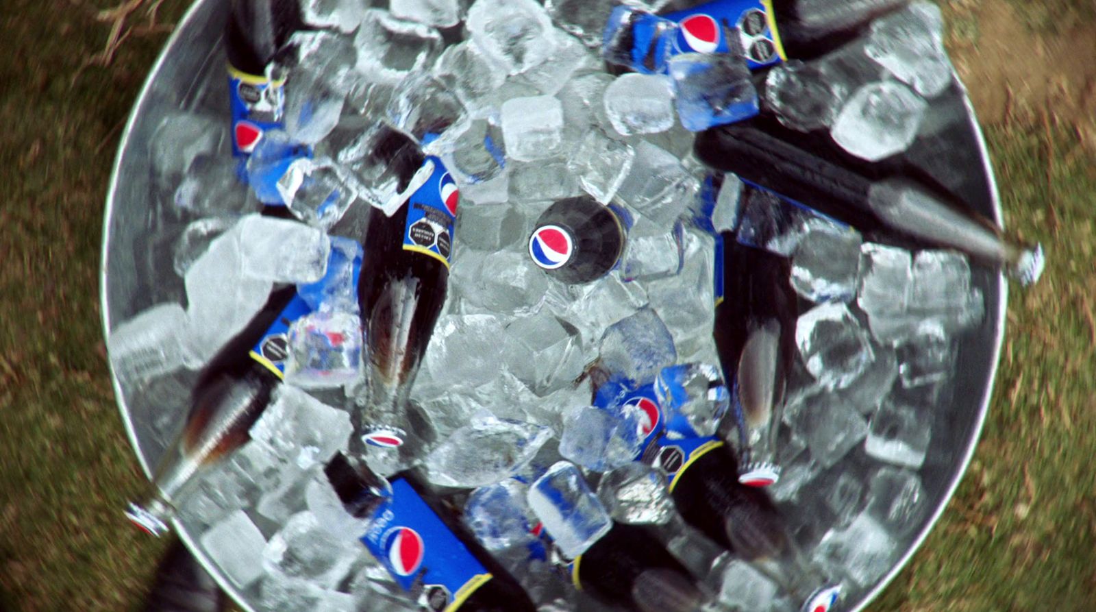 a bucket full of soda and fish on top of ice