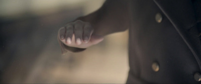 a close up of a person's hand with a blurry background