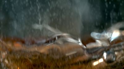 a blurry photo of a car in the rain