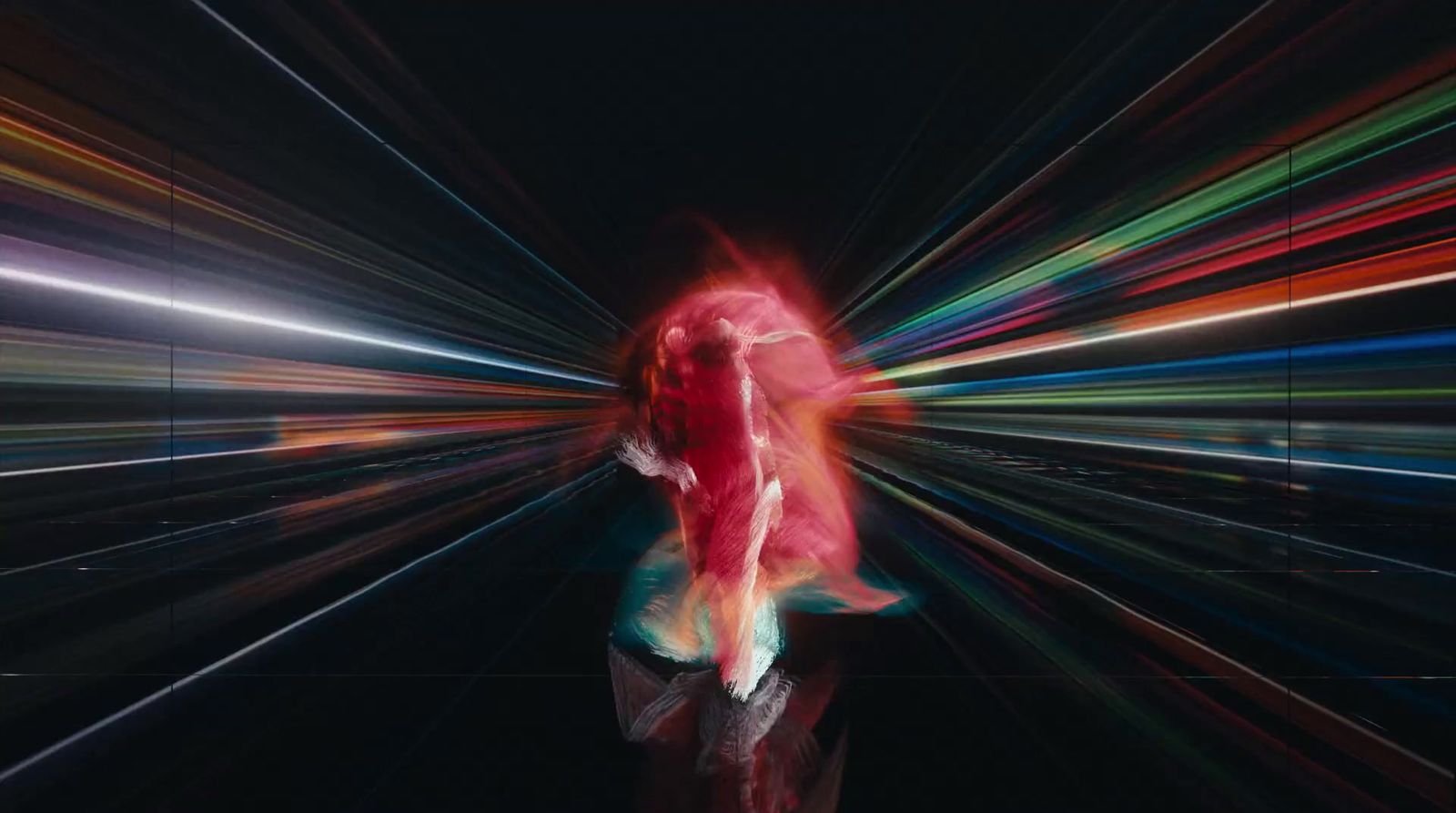 a woman walking through a tunnel of light