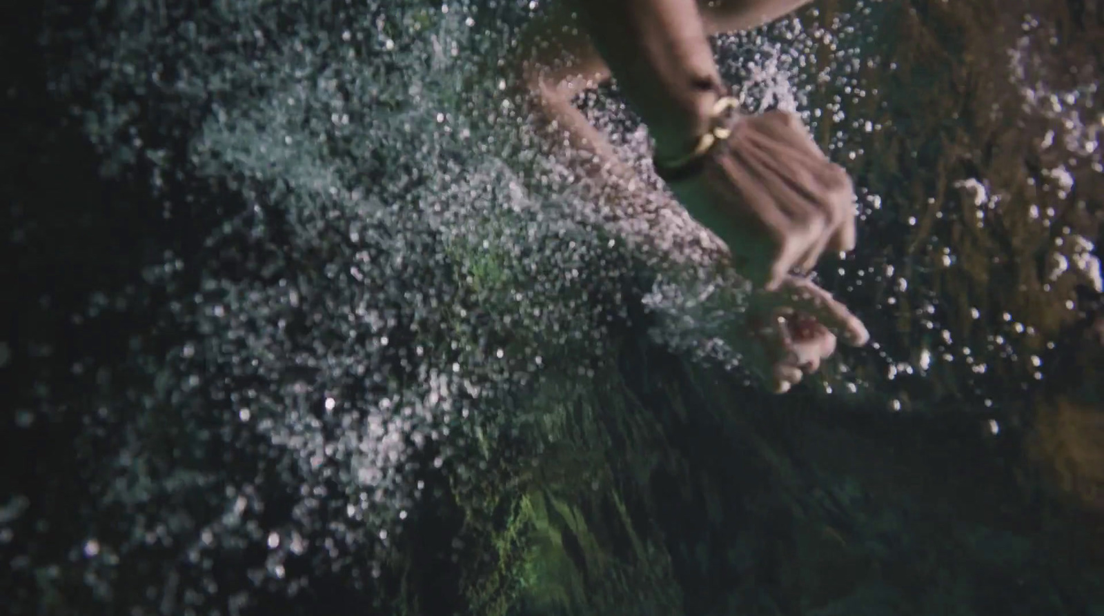 a person standing on a wave in the ocean