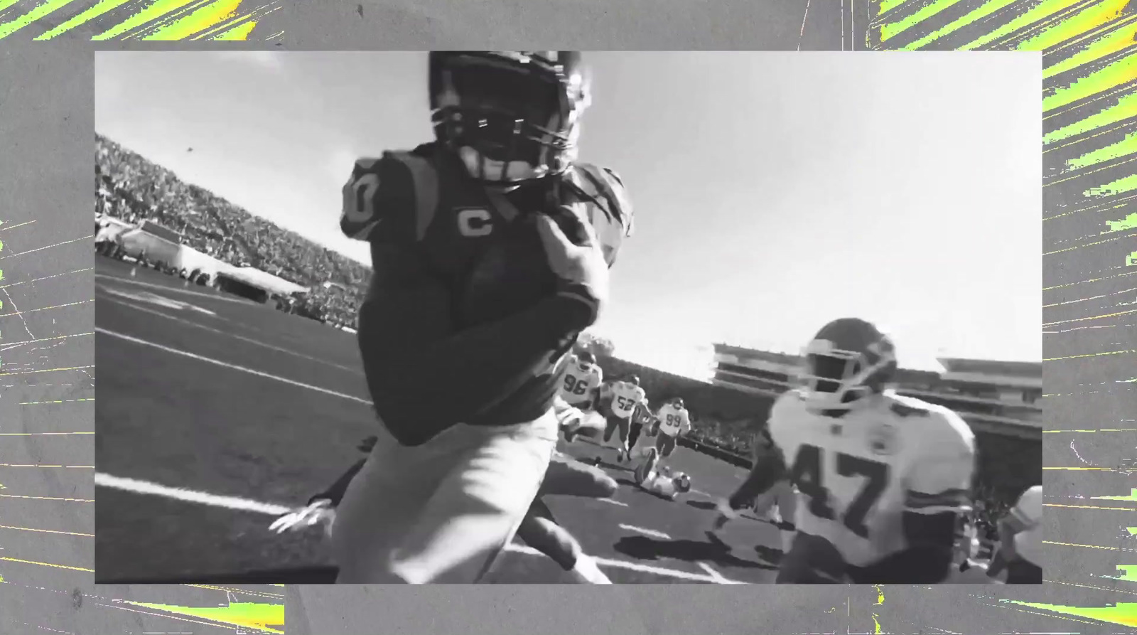 a black and white photo of a football player