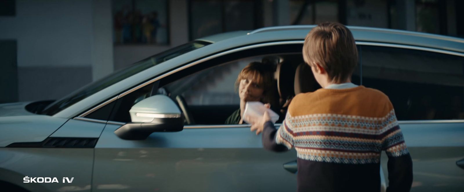 a woman looking out of a car window