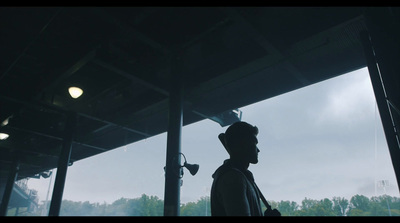 a man standing in front of a large window