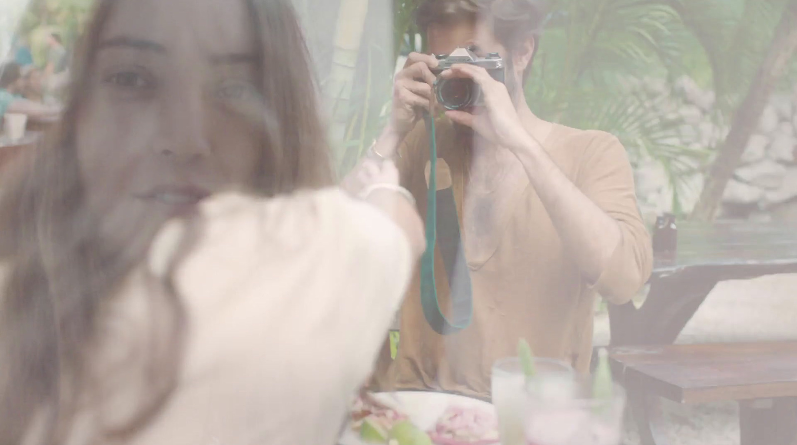 a woman taking a picture of herself in a mirror