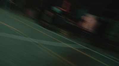 a blurry photo of a person riding a skateboard