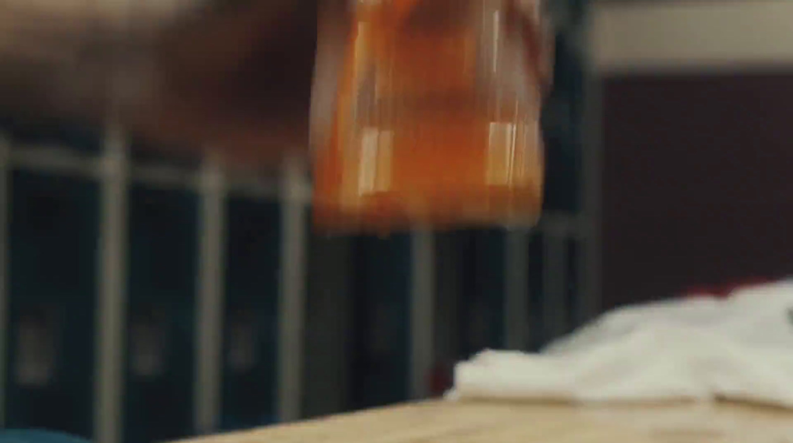 a blurry photo of a bottle of beer on a table