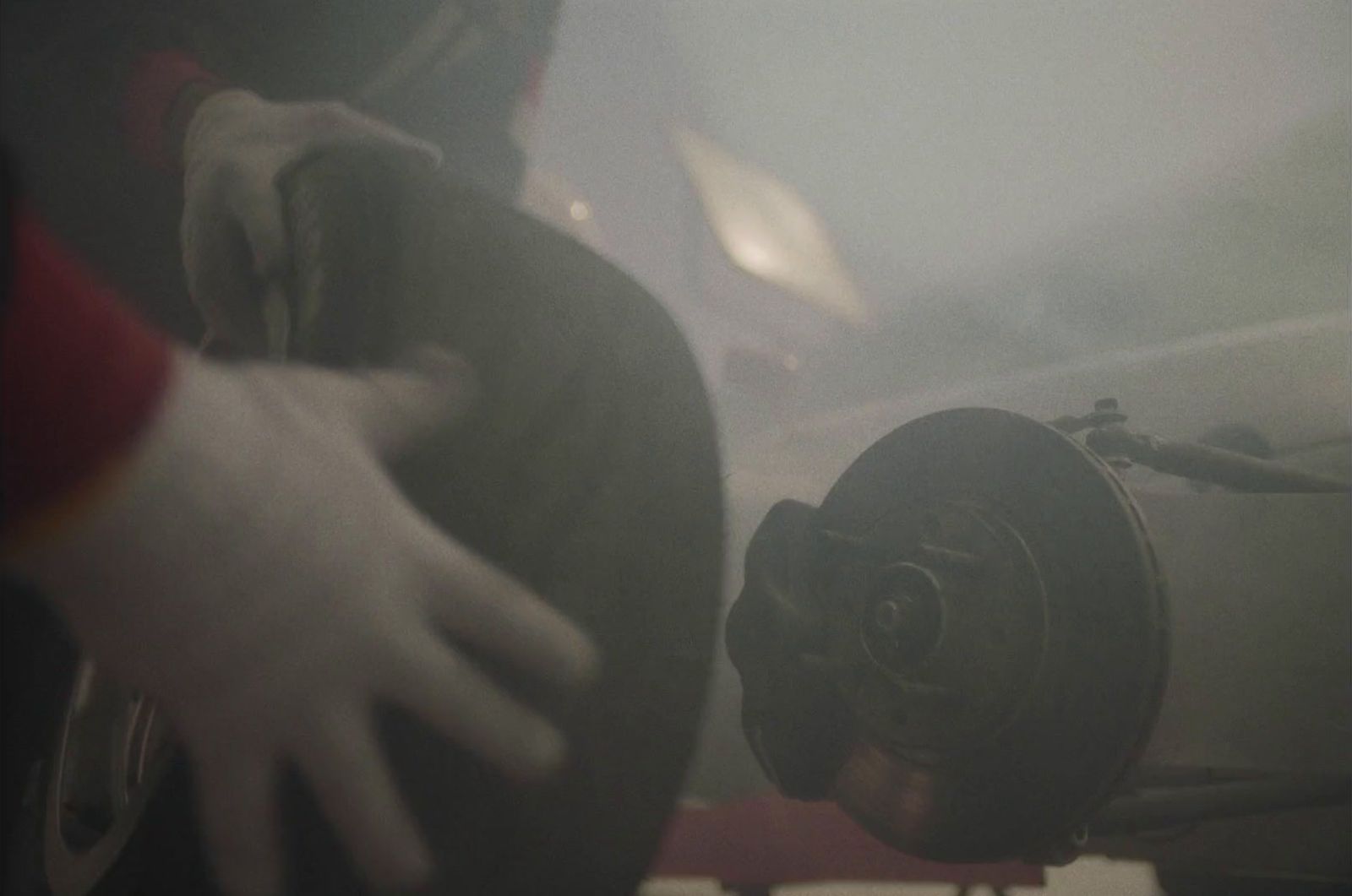 a close up of a person holding a steering wheel