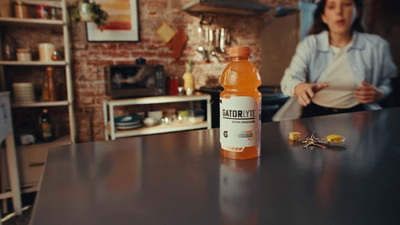 a bottle of orange juice sitting on top of a counter