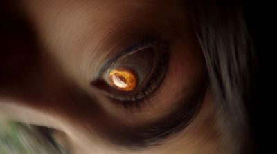 a close up of a person's eye with a blurry background