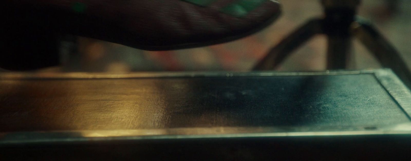 a close up of a person's foot on a table