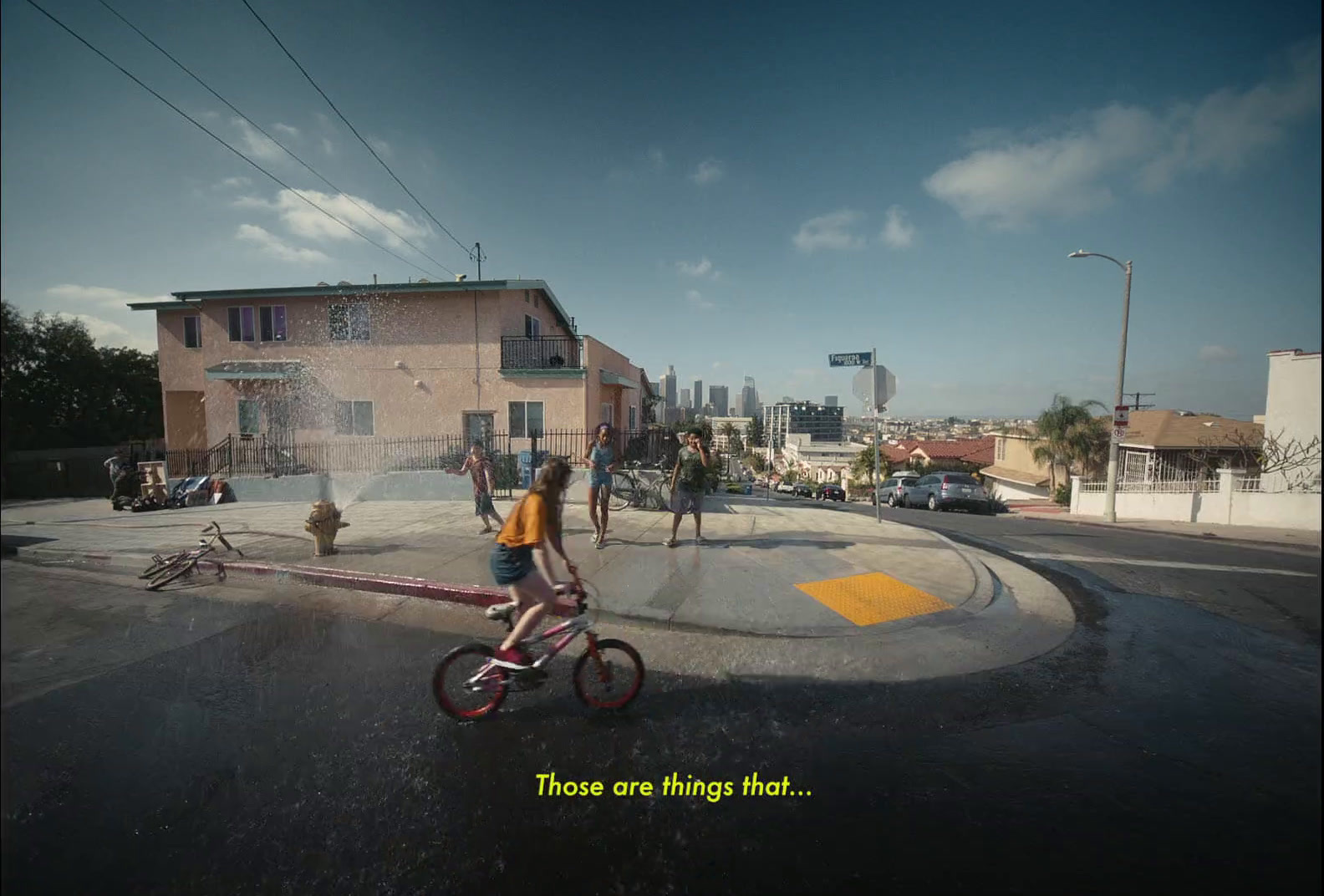 a person riding a bike on a street in a city