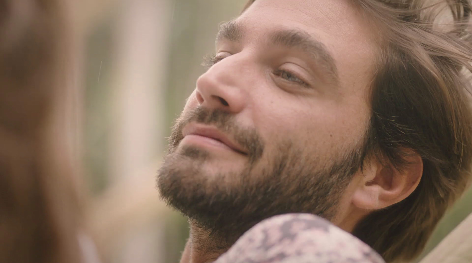 a close up of a person with a beard