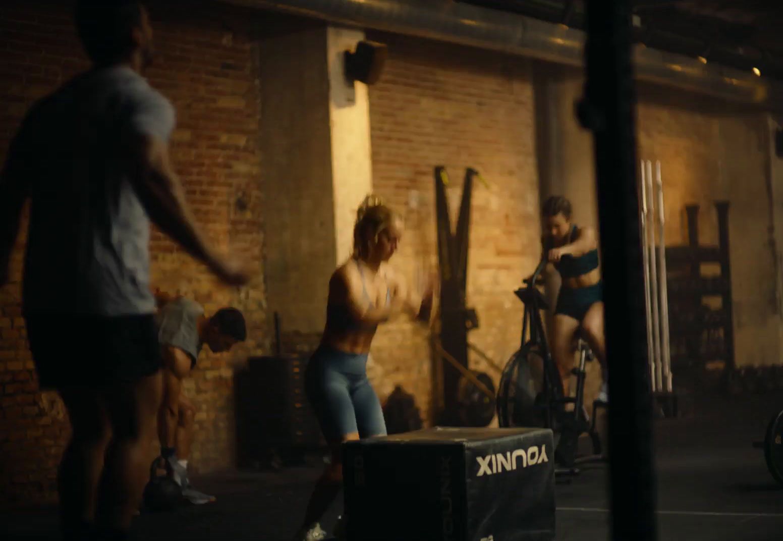 a group of people standing around in a room