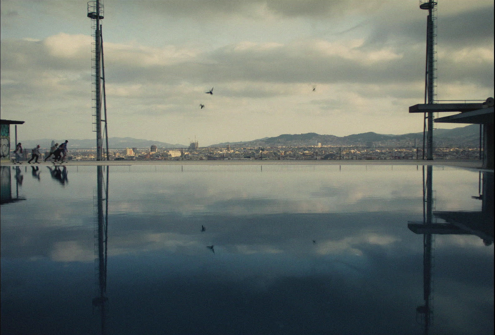 a swimming pool with a view of the city