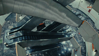 an aerial view of an escalator in a building