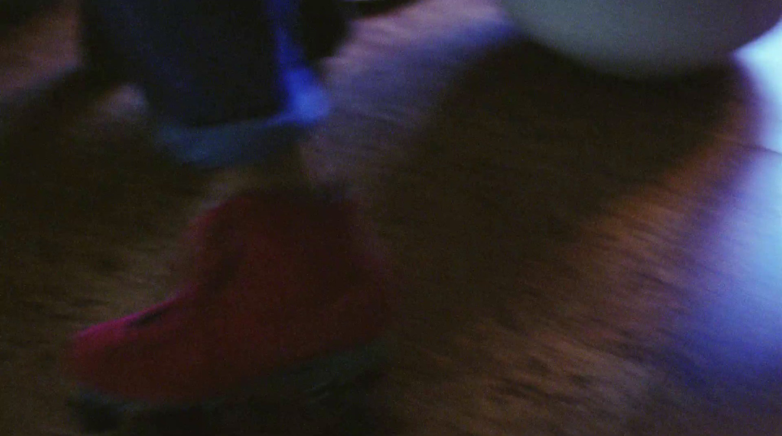 a blurry photo of a person's feet on a skateboard