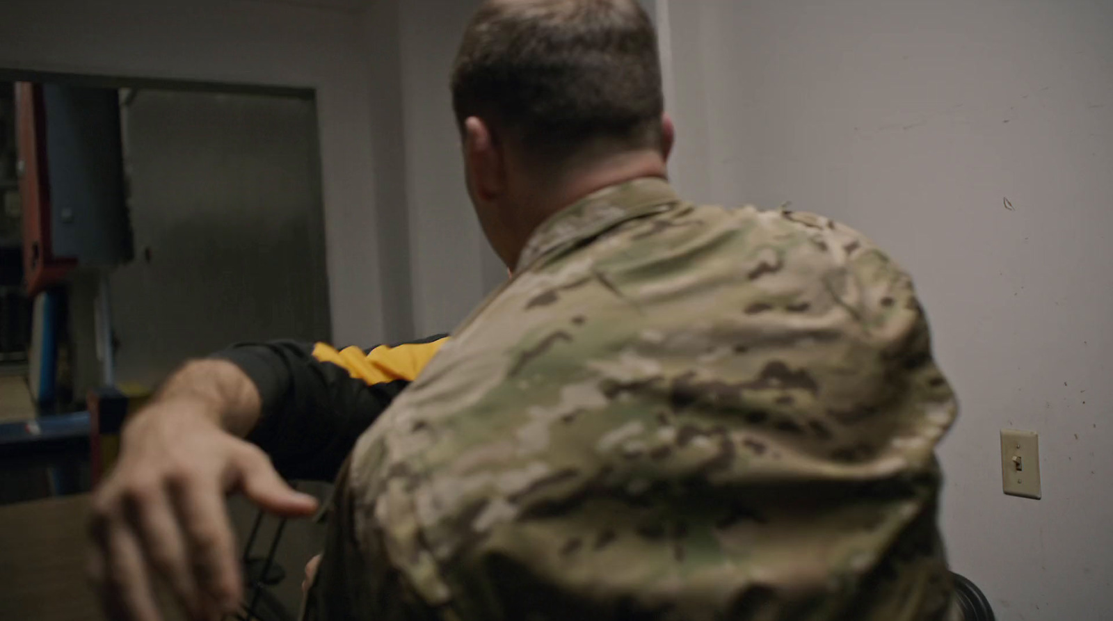 a man in a military uniform pointing at something