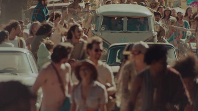 a crowd of people walking down a street