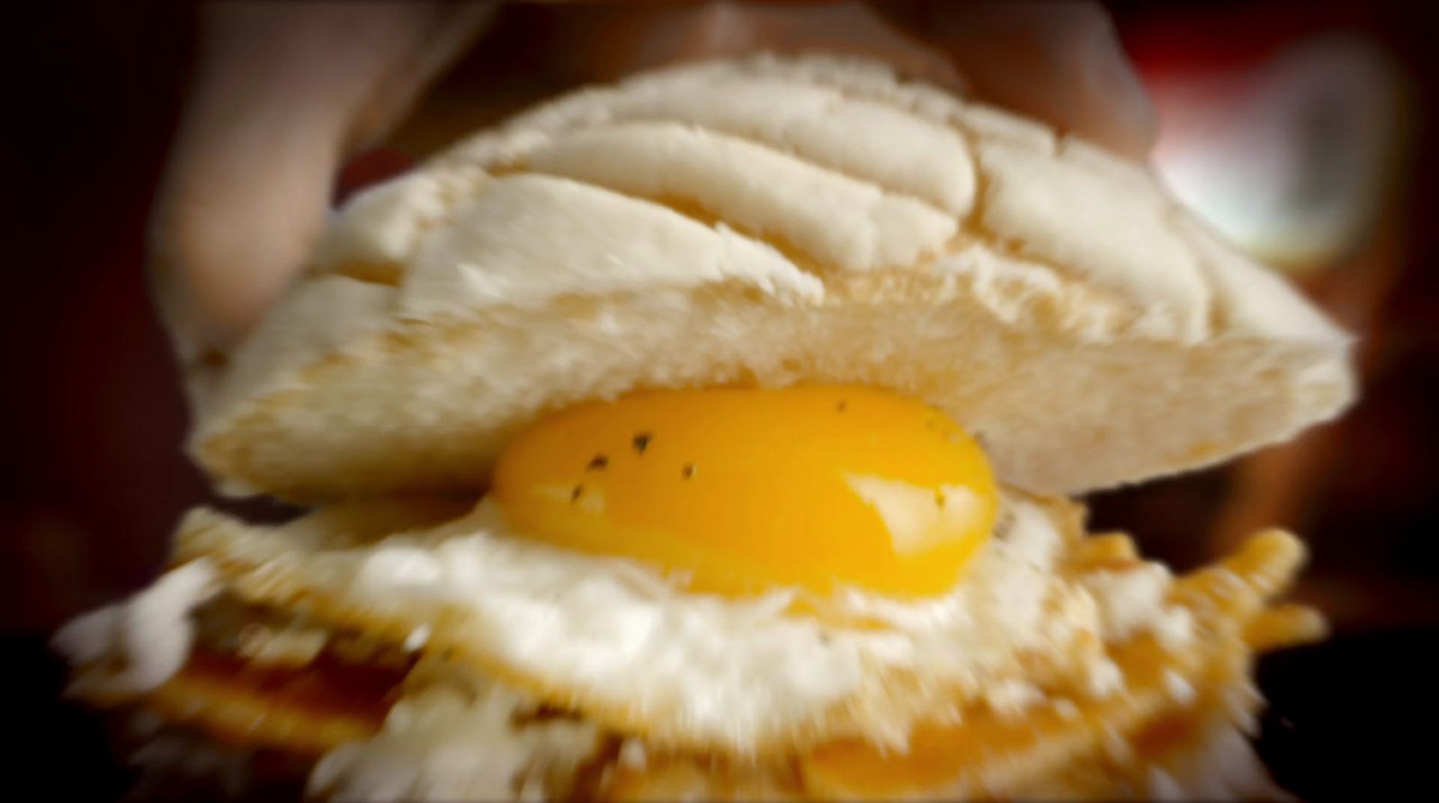 a close up of an egg on a banana