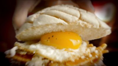 a close up of an egg on a banana