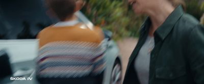 a blurry image of a woman walking next to a man