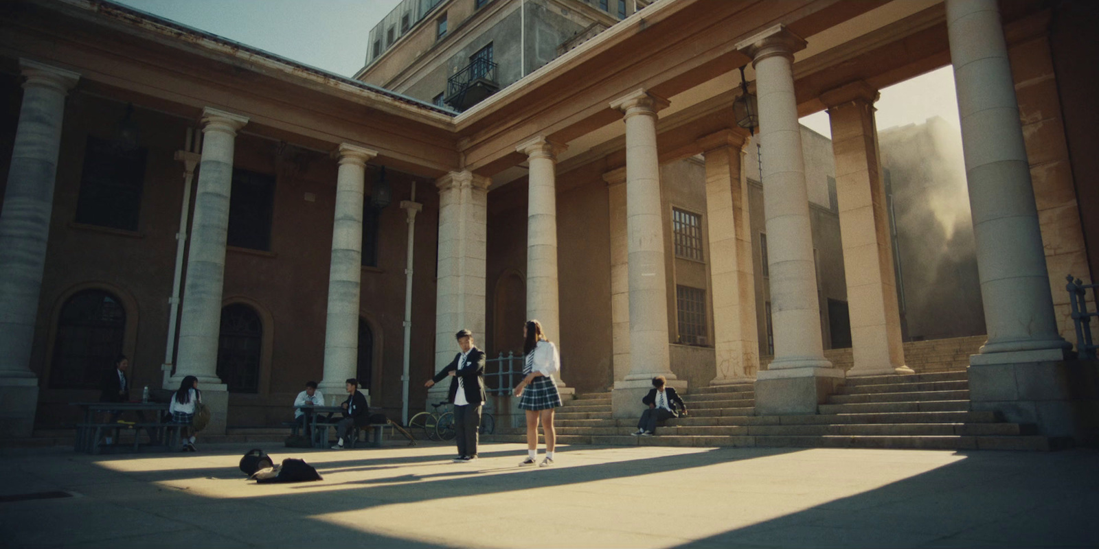 a group of people standing in front of a building