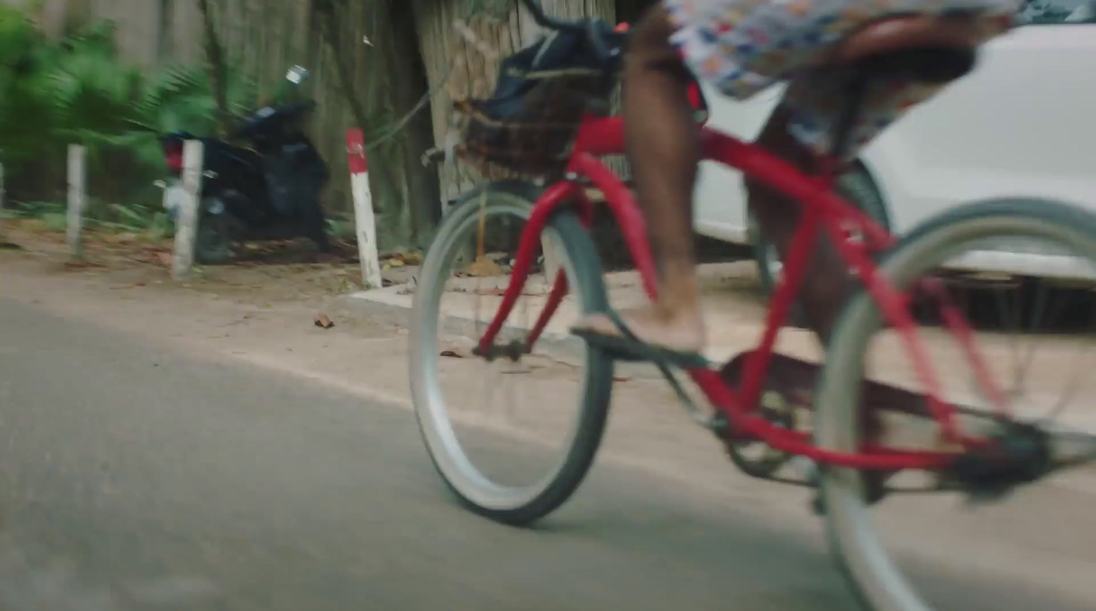 a person riding a bike down a street