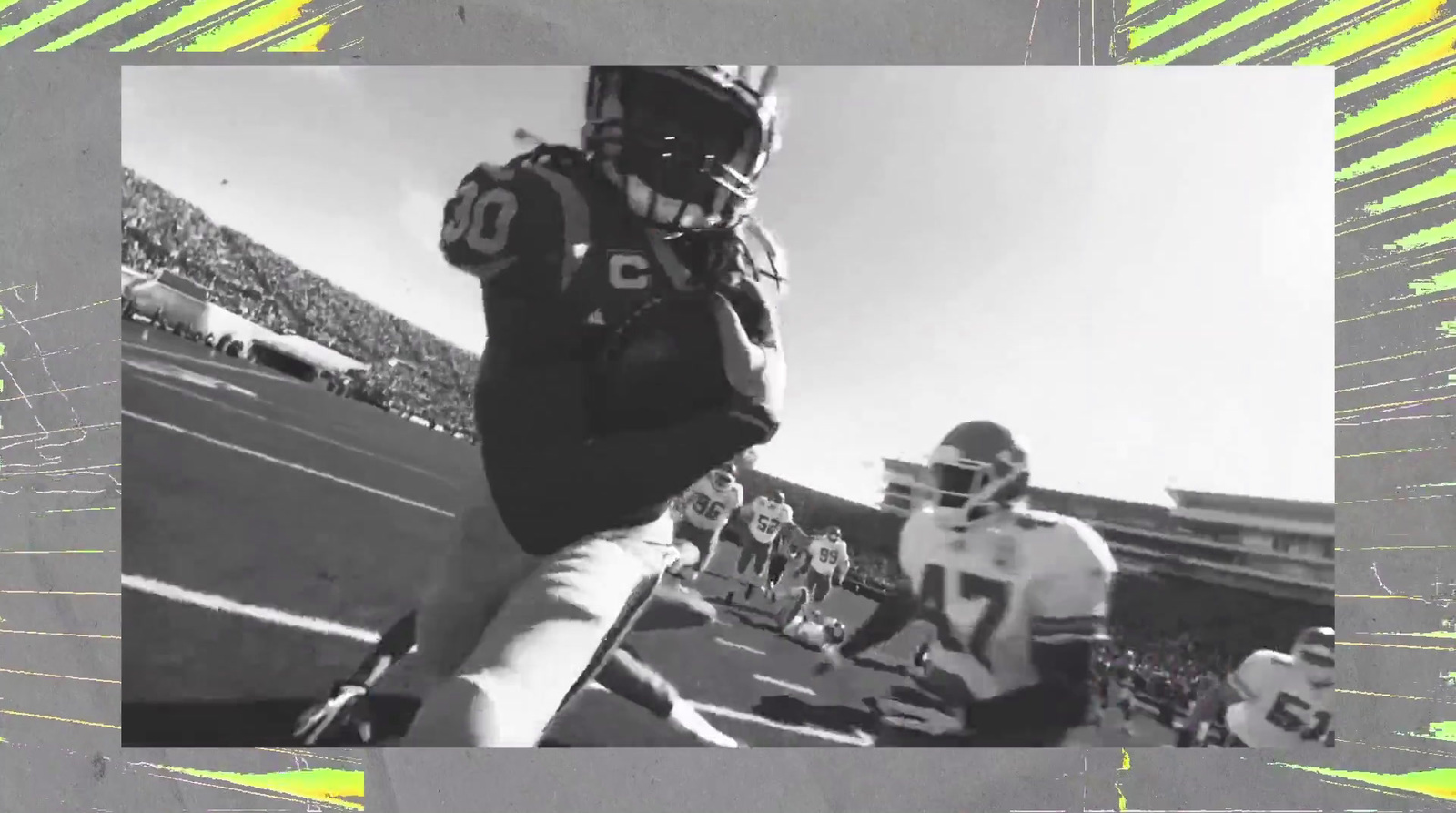 a black and white photo of a football player